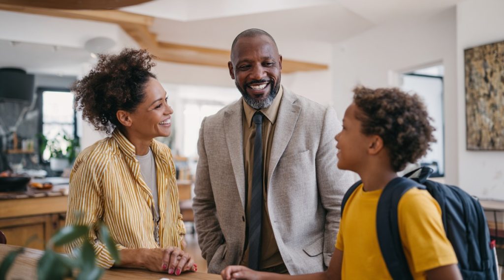 Two parents talking with their son in a home kitchen, representing a Stoneham, Massachusetts parenting plan